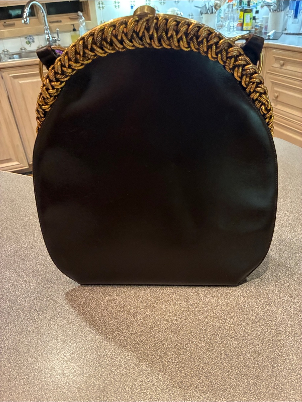 Elegant Black Shoulder Bag with Braided Gold Chain Accent